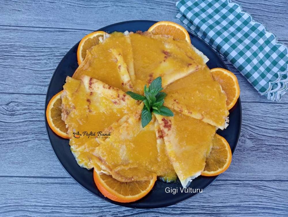 Clatite cu sos de portocale - crepes Suzette clatite sos portocale crepes suzette reteta gina bradea 2 - Clatite cu sos de portocale - crepes Suzette