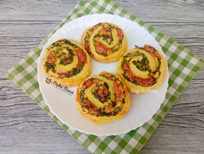Cornuri aperitiv din foietaj cu salam si cascaval spirale din foietaj cu spanac reteta gina bradea 5 697x525 - Cornuri aperitiv din foietaj cu salam si cascaval